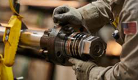 Excavator component being dismantled